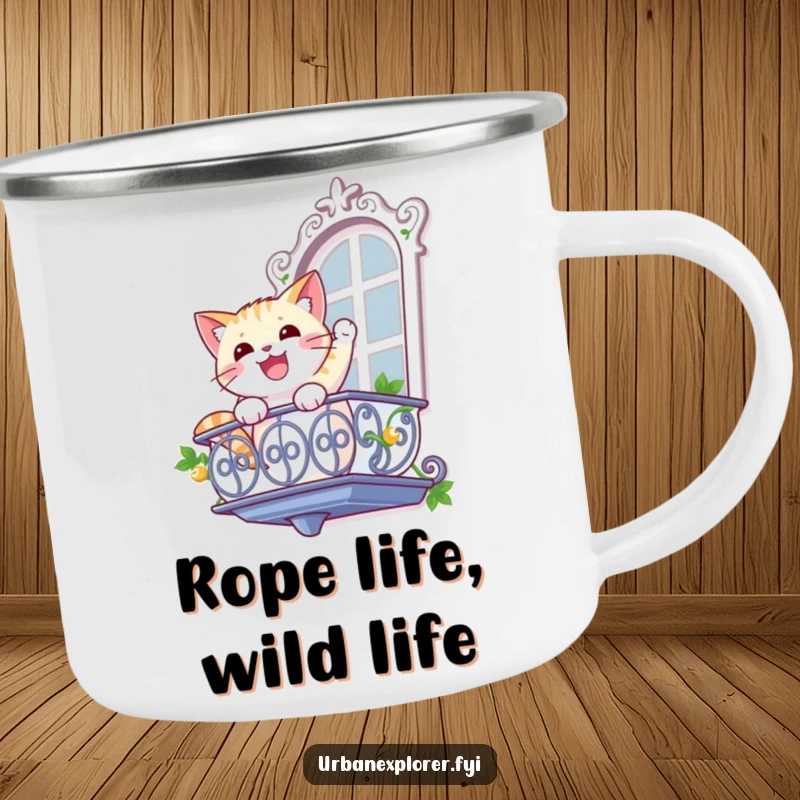 Funny cat camping mug with a gleeful cat rappelling down a balcony, perfect for adventurous sips and humorous mornings.