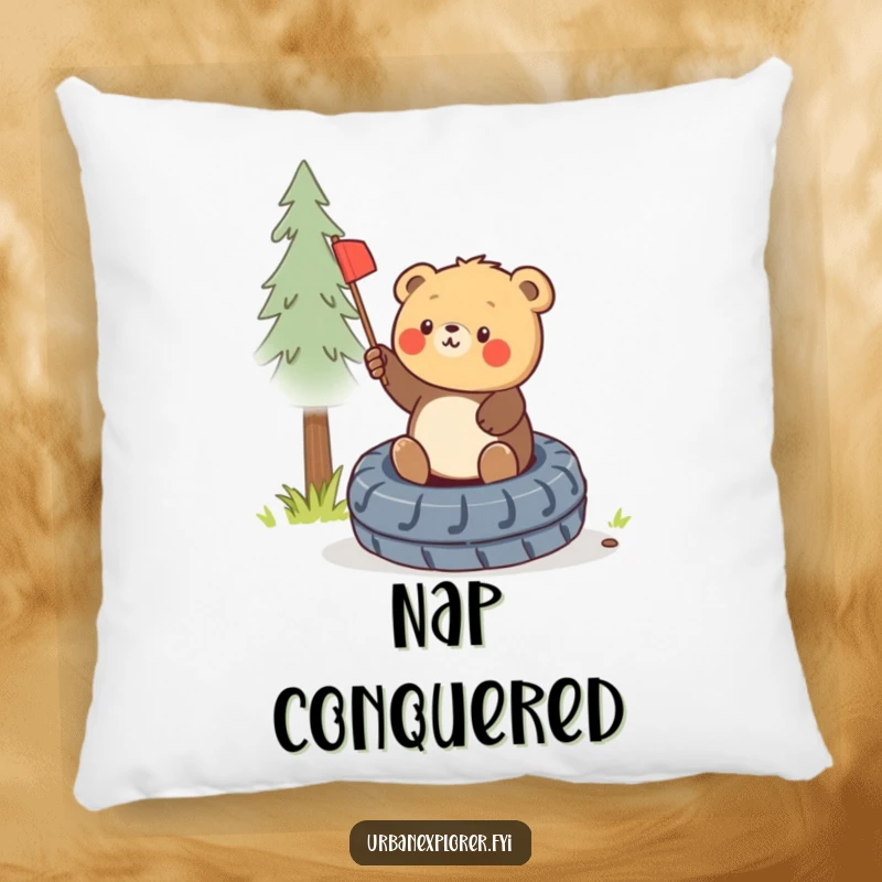 Funny pillow featuring a round bear cub triumphantly planting a miniature flag on a discarded tire, offering comfort and humor.