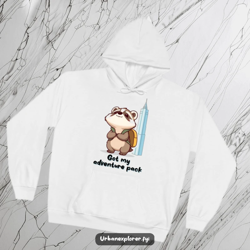 Funny Kawaii badger with a backpack, gazing at a towering building, printed on a warm and cozy hoodie.