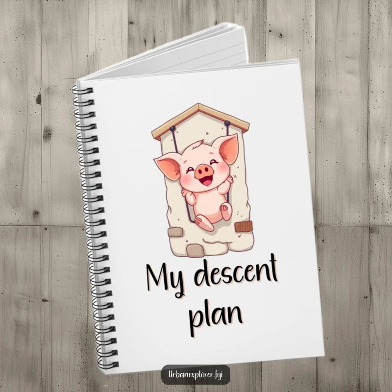 Funny notebook with a giggling piglet rappelling, providing space for notes and a daily dose of amusement.