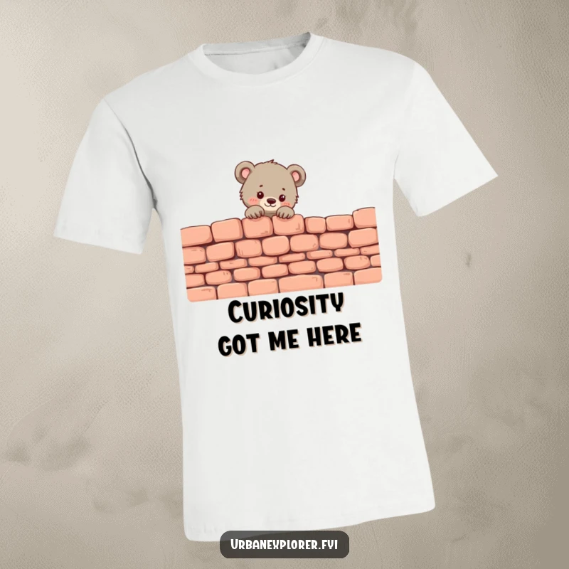 Funny Bear Cub T-Shirt: A tiny bear cub peeks over a crumbling brick wall, looking sweet and mischievous.